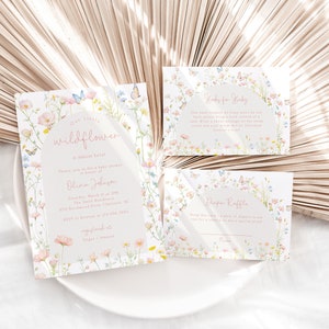 May include: Three cards with a floral design featuring butterflies and the text "Our little wildflower is almost here."  The cards are for a baby shower and include information about the event, a diaper raffle, and a "Gifts for Baby" section.