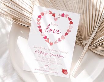 May include: A pink and red baby shower invitation with a heart made of smaller hearts. The text reads "baby love" and includes the details of the event: "Join us for a baby shower honoring Kathryn Jackson, Saturday, February 12 at 11AM, The Smith Residence, 7292 Valentine Lane, Miami, FL 89203, RSVP to Michelle at 123-456-7890, REGISTERED AT TARGET AMAZON".