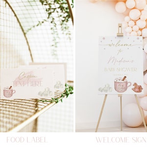 May include: A pink and gold welcome sign for a baby shower with the text "Welcome to Madison's Baby Shower". The sign features a watercolor illustration of a mug of hot chocolate with marshmallows and a rocking horse.
