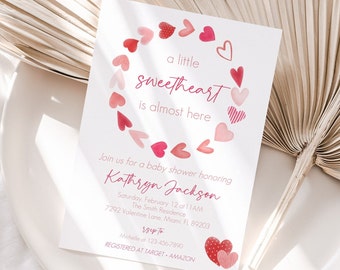May include: Baby shower invitation with a watercolor heart design. The invitation reads "a little sweetheart is almost here" and includes details for Kathryn Jackson's baby shower, including date, time, and location. RSVP information is also provided.