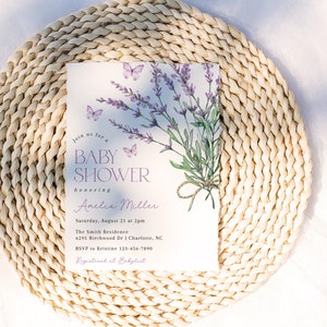 May include: A lavender-themed baby shower invitation with a watercolor illustration of lavender flowers and butterflies. The invitation includes the text "Join us for a Baby Shower honoring Anelia Miller" and details for the event.