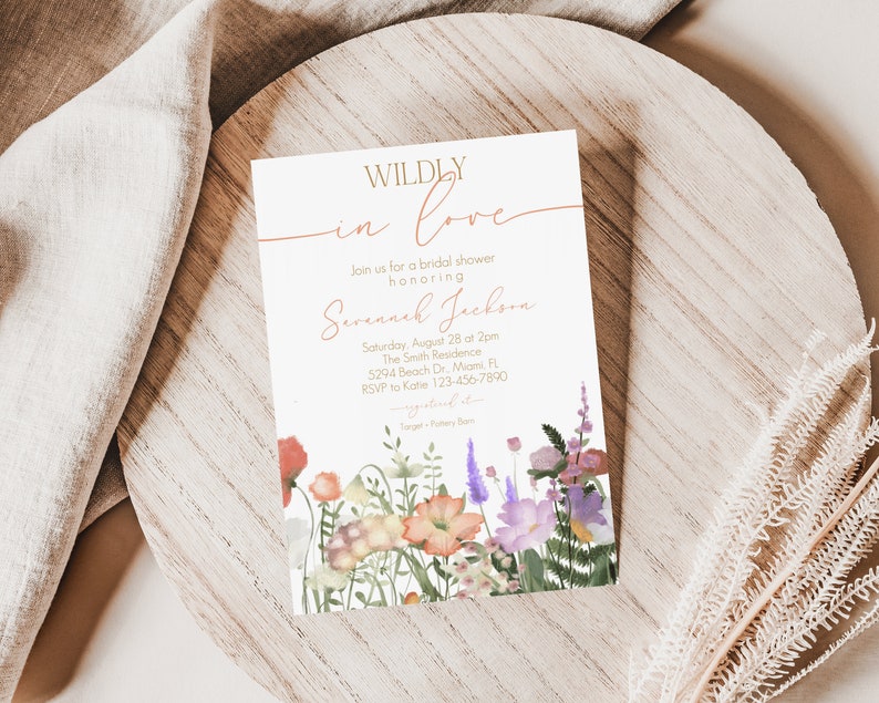 May include: A bridal shower invitation with a floral design. The invitation reads "WILDLY in love" and includes the name "Savannah Jackson" and details for the event.