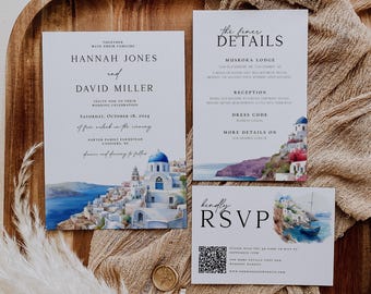 May include: A wedding invitation suite featuring three white cards with watercolor illustrations of a Greek coastal village. The text includes names Hannah Jones and David Miller, event details, and a QR code for RSVP. A gold wax seal stamp is included.