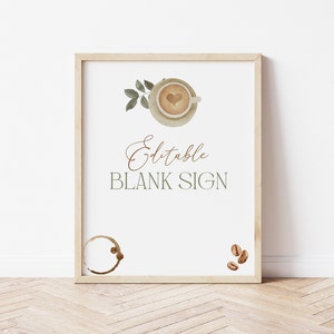 May include: Editable blank sign with a watercolor illustration of a coffee cup with a heart design, coffee beans, and a leaf branch. The sign is framed in a light wood frame.