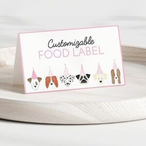 May include: Printable food label with the text "Customizable FOOD LABEL" and a row of six cartoon dogs wearing pink party hats.