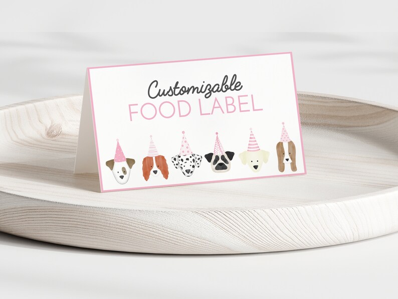 May include: Printable food label with the text "Customizable FOOD LABEL" and a row of six cartoon dogs wearing pink party hats.