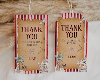 May include: Two red and white striped thank you tags with a pirate ship and palm tree design. The text on the tags reads "Thank You for celebrating with us!" and "Liam".