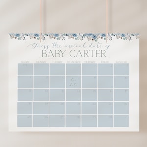K&ouml;nnte beinhalten: Ein blauer und wei&szlig;er Blumenkalender mit dem Text "Guess the arrival date of BABY CARTER" oben. Der Kalender ist f&uuml;r den Monat Juni und das F&auml;lligkeitstermin ist auf den 7. markiert.