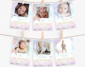 May include: A set of 12 printable baby milestone cards featuring a mermaid tail design with a glittery gold finish. Each card has a different month number and the word "MONTHS" printed in gold. The cards are designed for a baby's first year and can be used to document their growth.