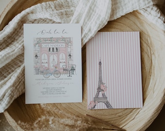 May include: A pink and white striped card with a watercolor illustration of the Eiffel Tower and flowers. The text on the card reads "Ooh la la".