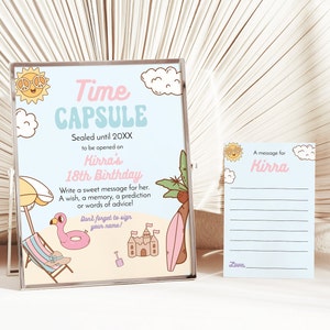 May include: A light blue and pink time capsule sign with a beach theme. The sign says "Time Capsule" and "Sealed until 20XX to be opened on Kirra's 18th Birthday". There is a beach umbrella, a pink flamingo, a sandcastle, and a surfboard on the sign. A separate card says "A message for Kirra" with lines for writing a message.