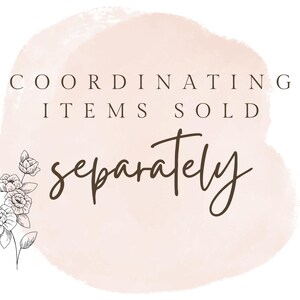 May include: A graphic with text that reads "COORDINATING ITEMS SOLD SEPARATELY" in a mix of serif and script fonts. A watercolor-style peach-colored shape is in the background. A black and white floral illustration is in the lower left corner.