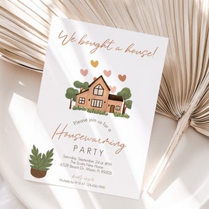 May include: A housewarming party invitation with a cartoon illustration of a house with trees and hearts. The text reads "We bought a house!" and "Please join us for a Housewarming Party". The invitation includes the date, time, address, and contact information.