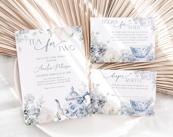 May include: A blue and white teacup and teapot with floral designs are featured on a baby shower invitation. The invitation is for a baby shower honouring Amelia Peterson. The invitation includes the date, time, and location of the shower. There are also two cards for a book and diaper raffle.