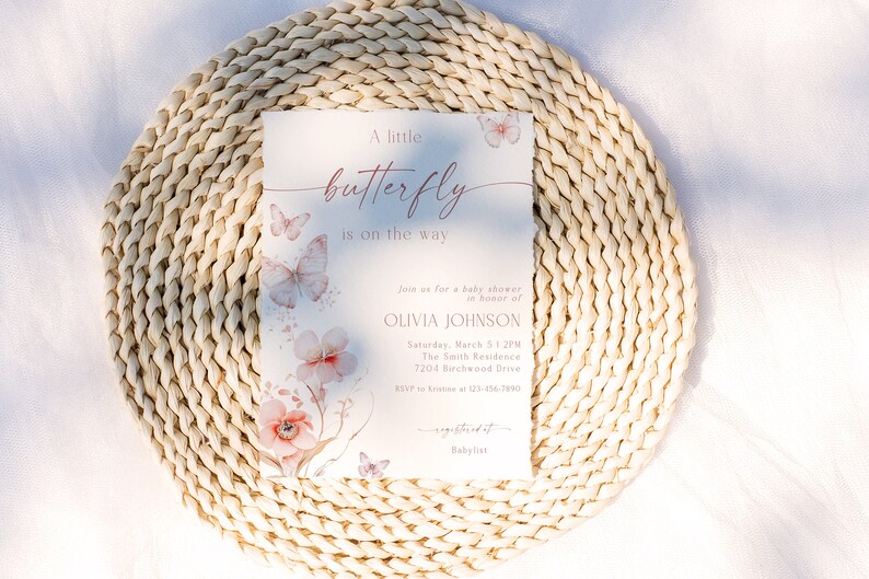 May include: A baby shower invitation with a watercolor butterfly design. The invitation is for Olivia Johnson and is set for Saturday, March 5 at 1:2PM at The Smith Residence, 7204 Birchwood Drive. RSVP to 123-456-7850. The invitation also includes a link to a baby registry.