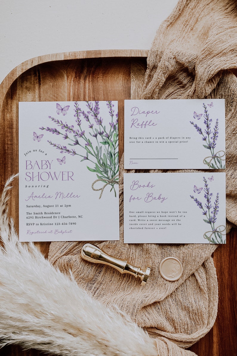 May include: Lavender-themed baby shower invitation with a watercolor illustration of lavender flowers and butterflies. The invitation includes the text "Join us for a Baby Shower honoring Amelia Miller" and details about the event, including the date, time, location, and RSVP information. The invitation also includes a diaper raffle card and a "Books for Baby" card.