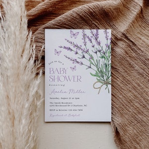 May include: A lavender-themed baby shower invitation with butterflies and the text "Join us for a Baby Shower honoring Amelia Miller. Saturday, August 21 at 2pm. The Smith Residence 6295 Birchwood Dr | Charlotte, NC. RSVP to Kristine 123-456-7890. Registered at Babylist."