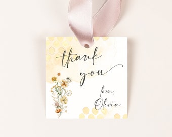 May include: A yellow and white thank you tag with a bee and flowers. The tag says "thank you" and "love, Olivia".