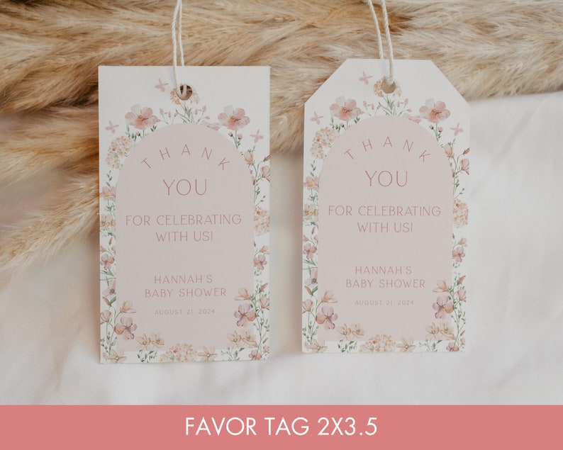 May include: Two pink and white favour tags with floral designs and the text "Thank You for Celebrating with Us!" and "Hannah's Baby Shower August 21, 2024".