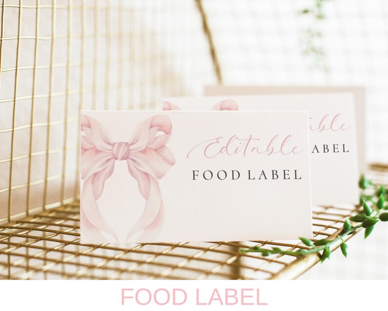 May include: Pink and white food labels with a watercolor bow design. The text "Editable Food Label" is printed on the label.