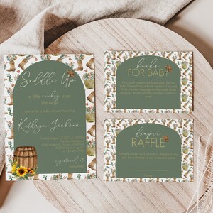 May include: A set of three printable cards for a baby shower. The cards are decorated with a green and white pattern of cowboy boots, sunflowers, and barrels. The text on the cards reads "Saddle Up", "Books for Baby", and "Diaper Raffle".