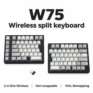 May include: A W75 wireless split keyboard with a black frame and white keys featuring black lettering. The set includes two separate keyboard halves and a small USB receiver. Text on the image reads W75 Wireless split keyboard, 2.4 GHz Wireless, Hot-swappable, and VIAL Remapping.
