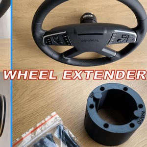 May include: A black MOZA TSW wheel extender kit. The image shows a steering wheel, a wheel extender, and other components. The text "MOZA TSW WHEEL EXTENDER" is displayed in red and white. The steering wheel has buttons and a leather grip.
