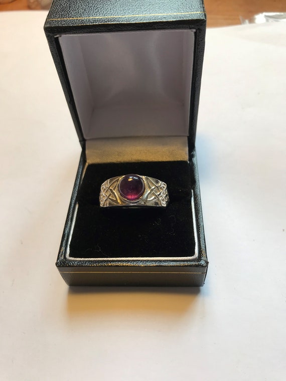 mans Celtic ring with set gem