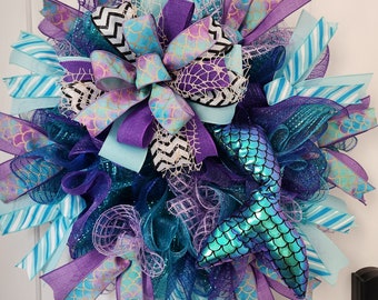 Introducing The absolutely gorgeous mermaid  Wreath with movable mermaid tail!The colors are bright and ready for an under the sea adventure