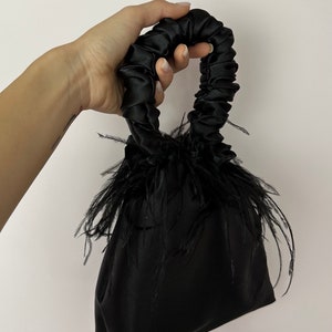 Scrunchie Bag with feathers in black