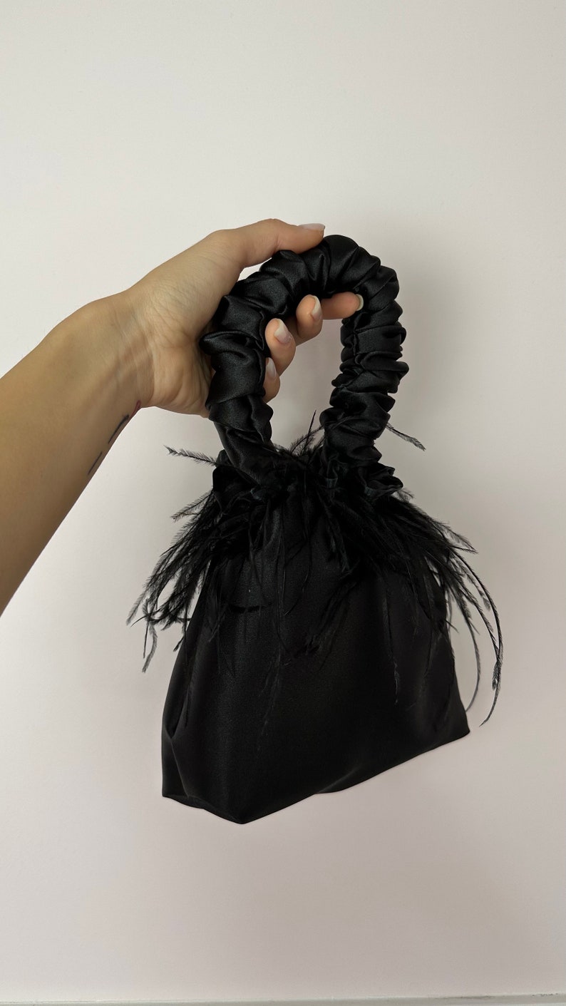 Scrunchie Bag with feathers in black