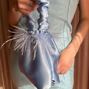 light blue feather bag