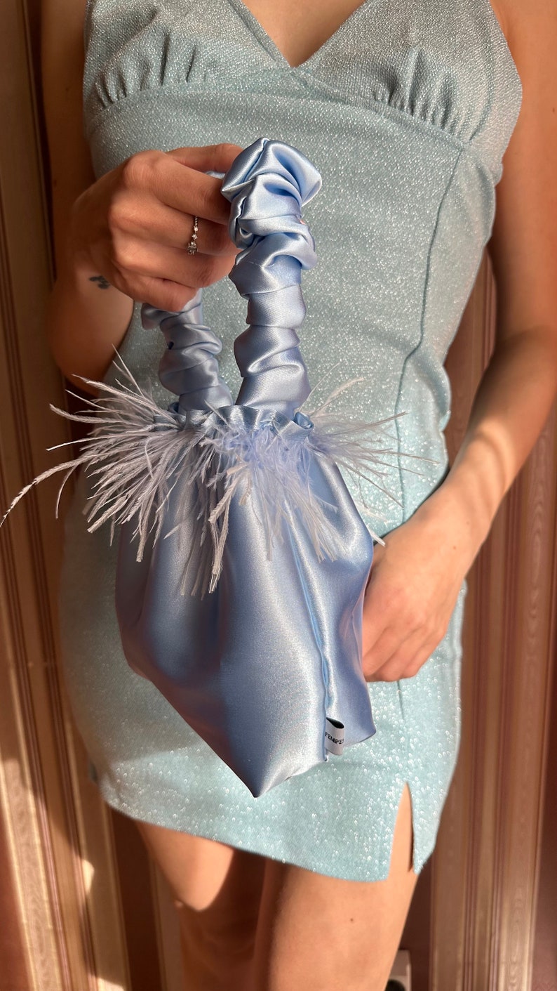 light blue feather bag