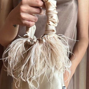 Bag with gold ostrich feathers