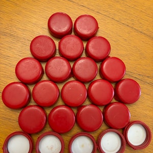 Used Makers Mark bourbon bottle caps with wax still attached!!  (Great for any DIY project)