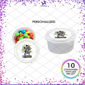 May include: 10 clear plastic containers with lids, each with a personalized Beyblade label featuring a group of characters. The label says "Beyblade" and "Jaxon". The containers are filled with colorful candy.