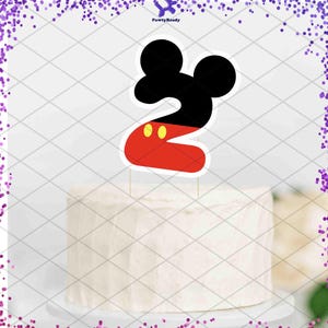 May include: A cake topper in the shape of the number 2, designed with a black Mickey Mouse head and a red body with yellow accents. The topper is on a white frosted cake. The text "PawtyReady" is in the top right corner.