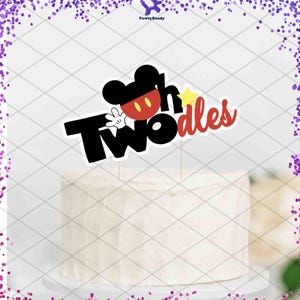 May include: A white ceramic mug with a black handle and the text "But First, Coffee" in a black, handwritten-style font. The mug is on a white surface.