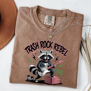 Comfort Colors® Trash Rock Rebel Raccoon T-Shirt – Punk Rock Animal Graphic Tee, Funny Grunge Band Shirt, Trash Panda Music Lover Gift
