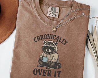 Comfort Colors® Chronically Over It, Funny Raccoon Graphic Tee for Adults, Grumpy Animal Shirt, Introvert Burnout Humor Unisex Gift