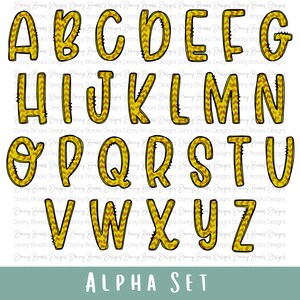Peut inclure: Un ensemble complet de l'alphabet en majuscules, chaque lettre est soulignée en noir avec un motif en chevrons or et marron. Les lettres sont affichées sur fond blanc. Le texte "ALPHA SET" est en bas.
