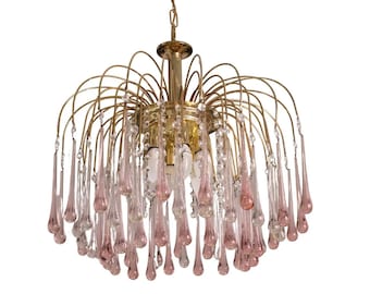 May include: A vintage chandelier with a brass frame and cascading pink and clear glass teardrop crystals. The light fixture hangs from a chain and features multiple light bulbs. The overall design is elegant and decorative.