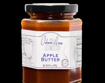 Könnte beinhalten: Ein Glas Apfelbutter mit einem weißen Etikett, auf dem "Osburn Acres Apple Butter Net Wt 12 oz (340g)" und ein Gluten-frei-Zertifizierungslogo stehen.