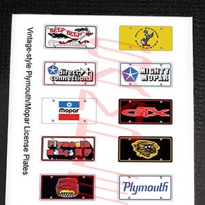 May include: A sheet of vintage-style Plymouth and Mopar license plates. The plates feature various logos and slogans, including "Beep Beep!" with a cartoon roadrunner, "Direct Connection", "Mighty Mopar", "Mopar", "GX", "Plymouth Makes It", "Plymouth", and "Road Runner Superbird".
