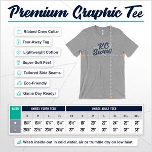 May include: A gray t-shirt with a teal blue and white graphic that says "KC Swag". The t-shirt is a unisex style and is available in youth and adult sizes. The t-shirt is made of lightweight cotton and has a ribbed crew collar, tear-away tag, and tailored side seams.