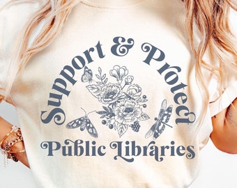 May include: A white t-shirt with a blue graphic that says "Support & Protect Public Libraries" with a floral design and butterflies.