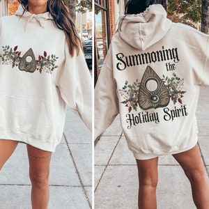 Summoning the Holiday Spirit Hooded Sweater, Dark Witchy Cottagecore Winter Hoodie , Ouija Planchette Sweatshirt Gift for Mystical Mama
