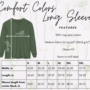 May include: A size chart for a long-sleeved t-shirt in various sizes, including S, M, L, XL, 2XL, and 3XL. The chart shows the width, length, and sleeve length from the center back in inches. The shirt is made of 100% ring-spun cotton and has a classic fit.