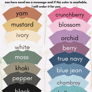 May include: A chart of t-shirt colors offered by Comfort Colors. The colors are arranged in two columns. The left column includes colors like yam, mustard, ivory, white, moss, khaki, pepper, and black. The right column includes colors like crunchberry, blossom, orchid, berry, true navy, blue jean, chambray, and chalky mint. The text at the top of the chart reads "Comfort Colors... Colors." The text at the bottom of the chart reads "For added contrast lighter shirts will have darker text."