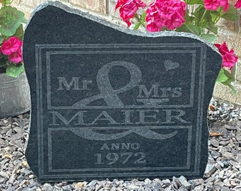 May include: Black granite stone with a carved inscription that reads "Mr & Mrs MAIER anno 1972".